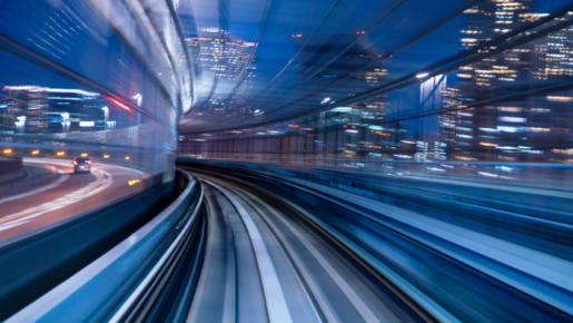 Railway line with light flashes suggesting a fast moving train